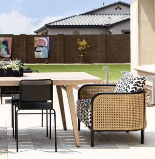 An outdoor dining with cane seaters