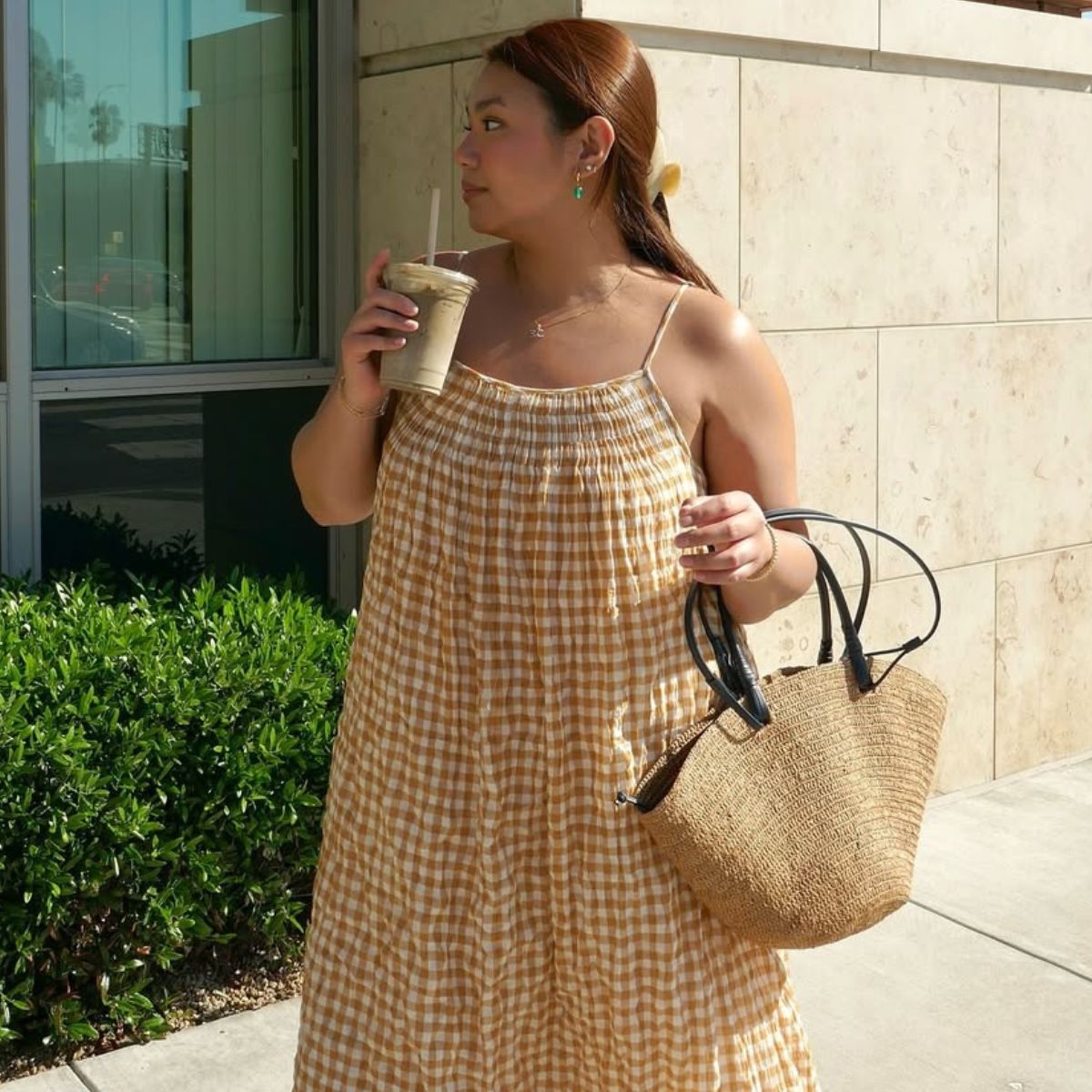 @marina_torres wears a yellow gingham midi dress