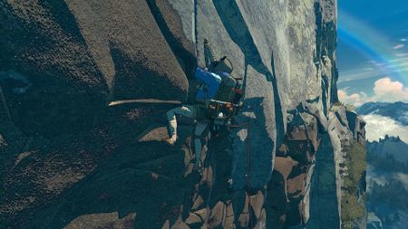 A screenshot from the climbing game Cairn showing the player character, mountains, and gear