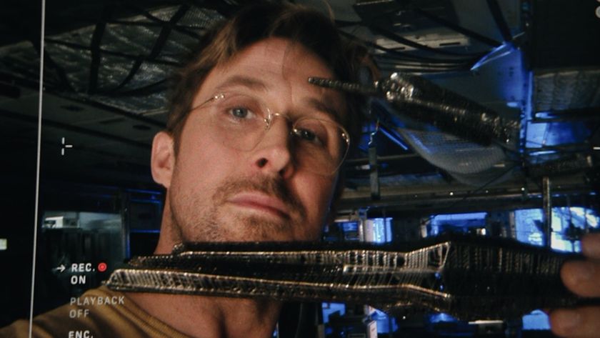 Ryan Gosling as Ryland holding up alien tech to a camera in Project Hail Mary. 