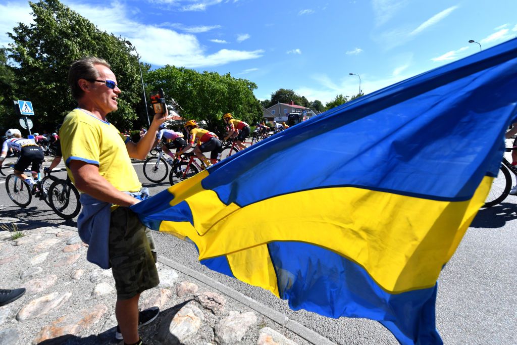 STROMSTAD SWEDEN AUGUST 10 A general view of the peloton competing while fans cheer during the 8th Tour of Scandinavia 2022 Battle Of The North Stage 2 a 1538km stage from Orust to Strmstad UCIWWT tourofscandinavia TOSC22 on August 10 2022 in Stromstad Sweden Photo by Luc ClaessenGetty Images