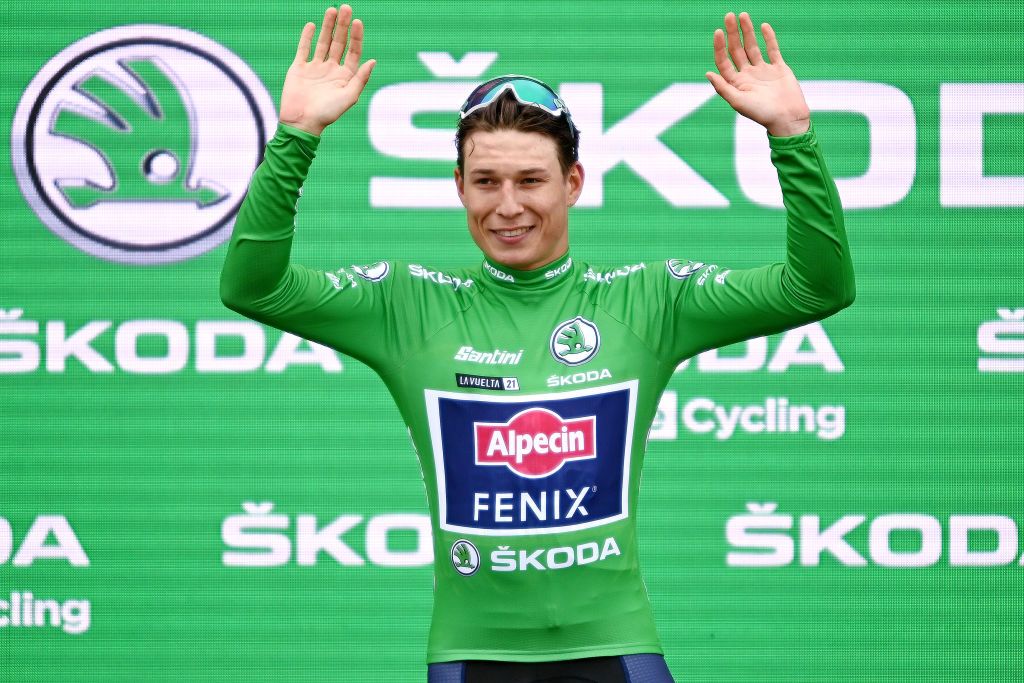 ESPINOSA DE LOS MONTEROS SPAIN AUGUST 16 Jasper Philipsen of Belgium and Team AlpecinFenix celebrates winning the green points jersey on the podium ceremony after the 76th Tour of Spain 2021 Stage 3 a 2028km stage from Santo Domingo de Silos to Espinosa de los Monteros Picn Blanco 1485m lavuelta LaVuelta21 CapitalMundialdelCiclismo on August 16 2021 in Espinosa de los Monteros Spain Photo by Stuart FranklinGetty Images
