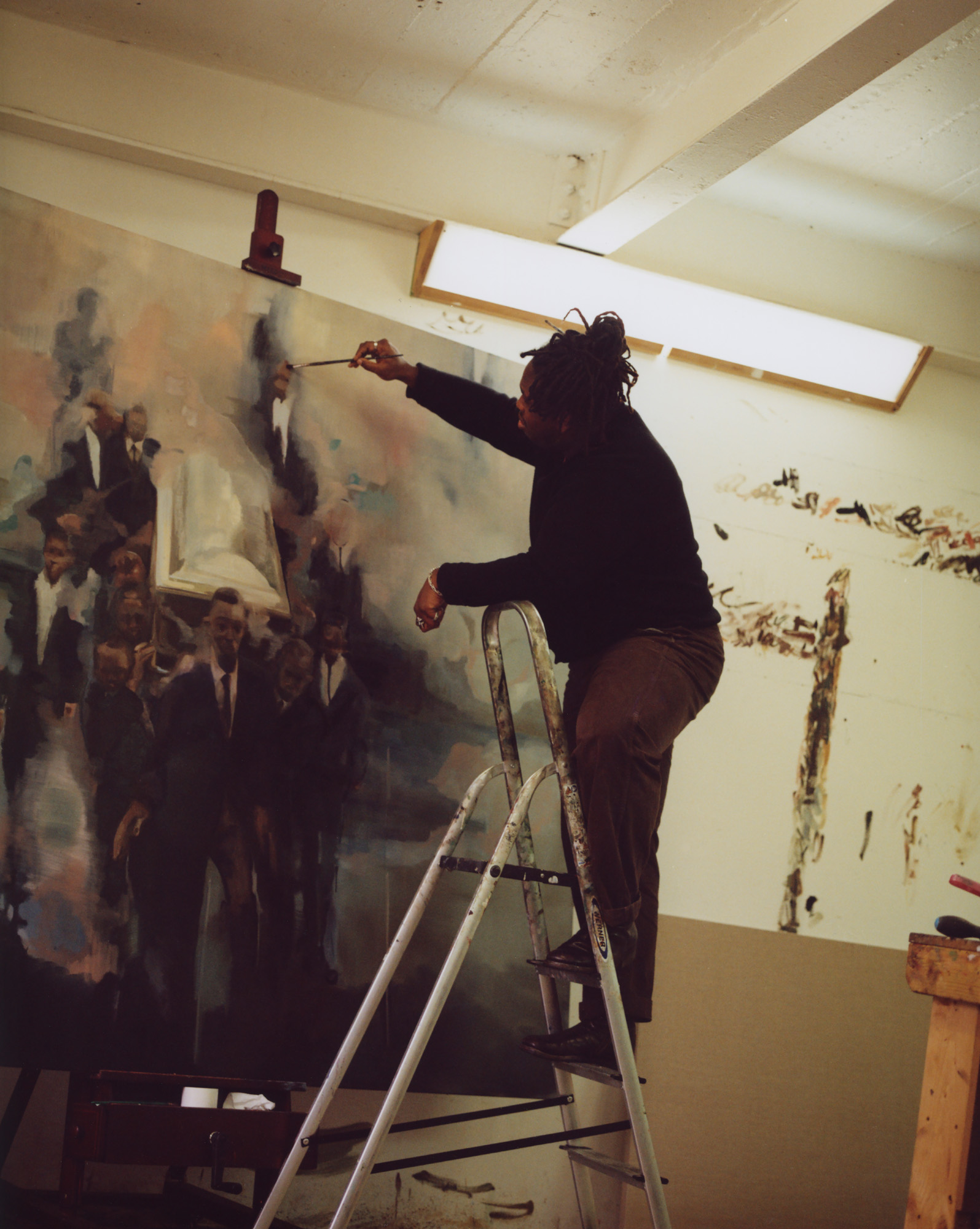 profile of artist in studio