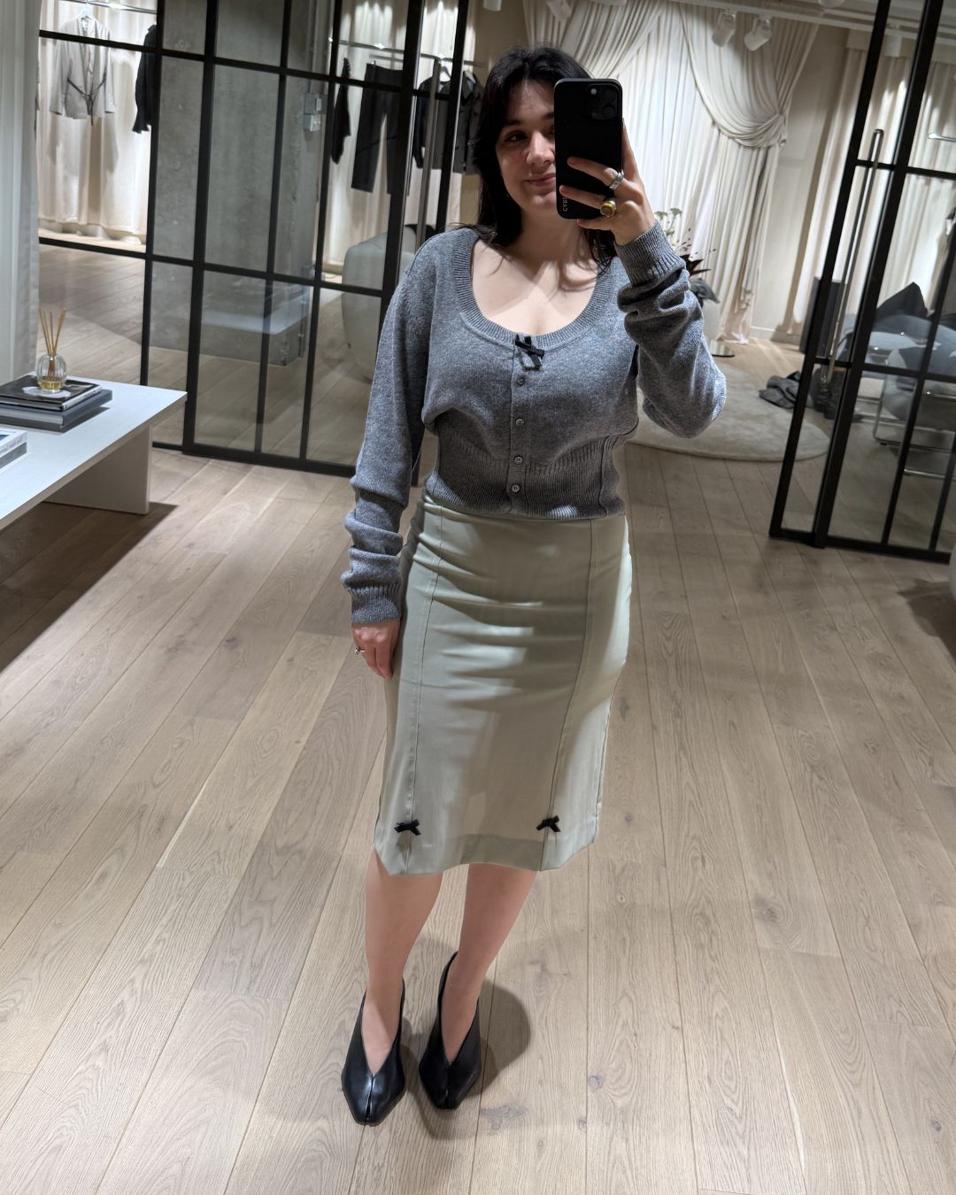 sofia piza tries on a skirt and cardigan from the new H&amp;amp;M studio collection