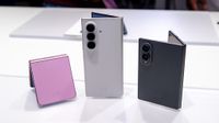 Comparing the sizes of the Samsung Galaxy Z Flip 8 (pink) with the white Galaxy Z Fold 8 Ultra and grey Galaxy Z Fold 8