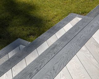 millboard composite decking steps in Enhanced Grain Smoked Oak with Brushed Basalt Bullnose Board