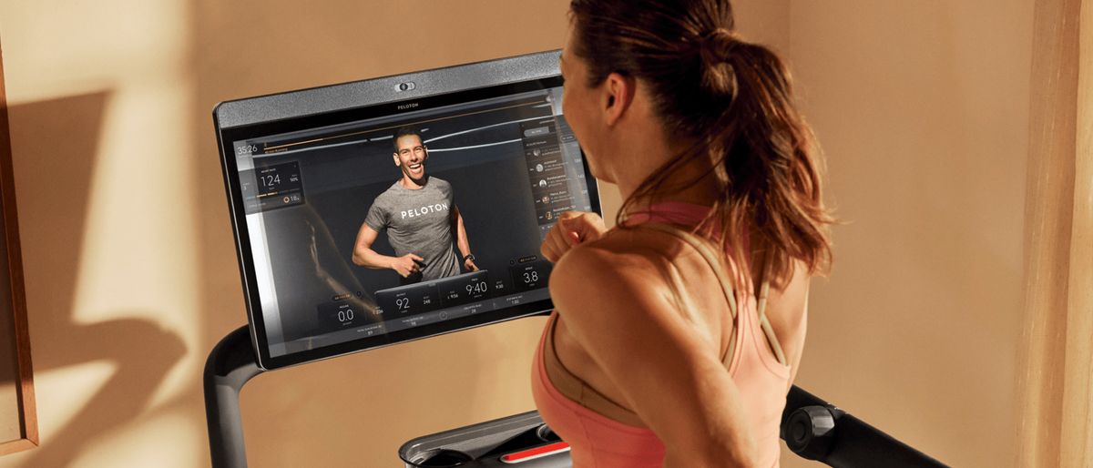 Woman running on Peloton Tread treadmill