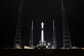 A SpaceX Falcon 9 rocket carrying a used Dragon cargo ship filled with NASA supplies for the International Space Station atop its Cape Canaveral Air Force Station launch site in Florida ahead of a Dec. 4, 2019 launch.