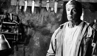 Rambo V: Last Blood Rambo stands in his workshop, in front of his knives