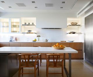 Modern white kitchen with island and wooden accents