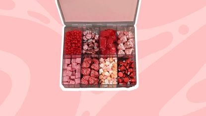 A snack organizer with sweets in it