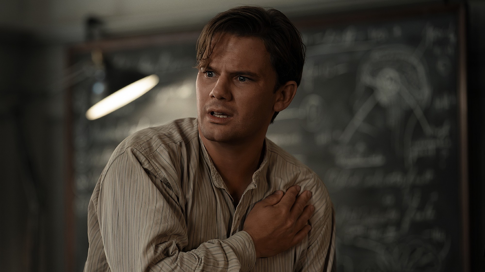 Jeremy Irvine as Henry in Outlander: Blood of My Blood clutching his chest and looking shocked. 