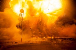 An Orbital ATK Antares rocket explodes just after launching from Pad-0A at NASA's Wallops Flight Facility on Wallops Island, Virginia, on Oct. 28, 2014. The rocket was carrying an unmanned Cygnus spacecraft filled with NASA cargo.