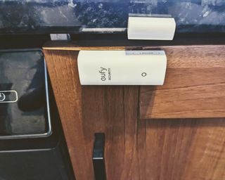 eufy alarm kit contact sensor attached to cupboard in writer's kitchen