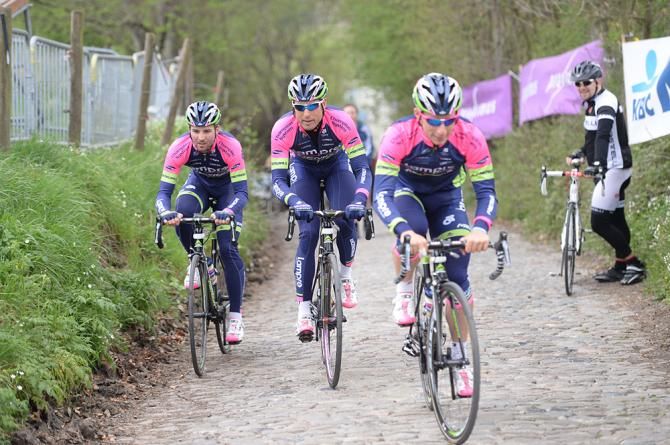 A fan watches the Lampre-Merida team come by