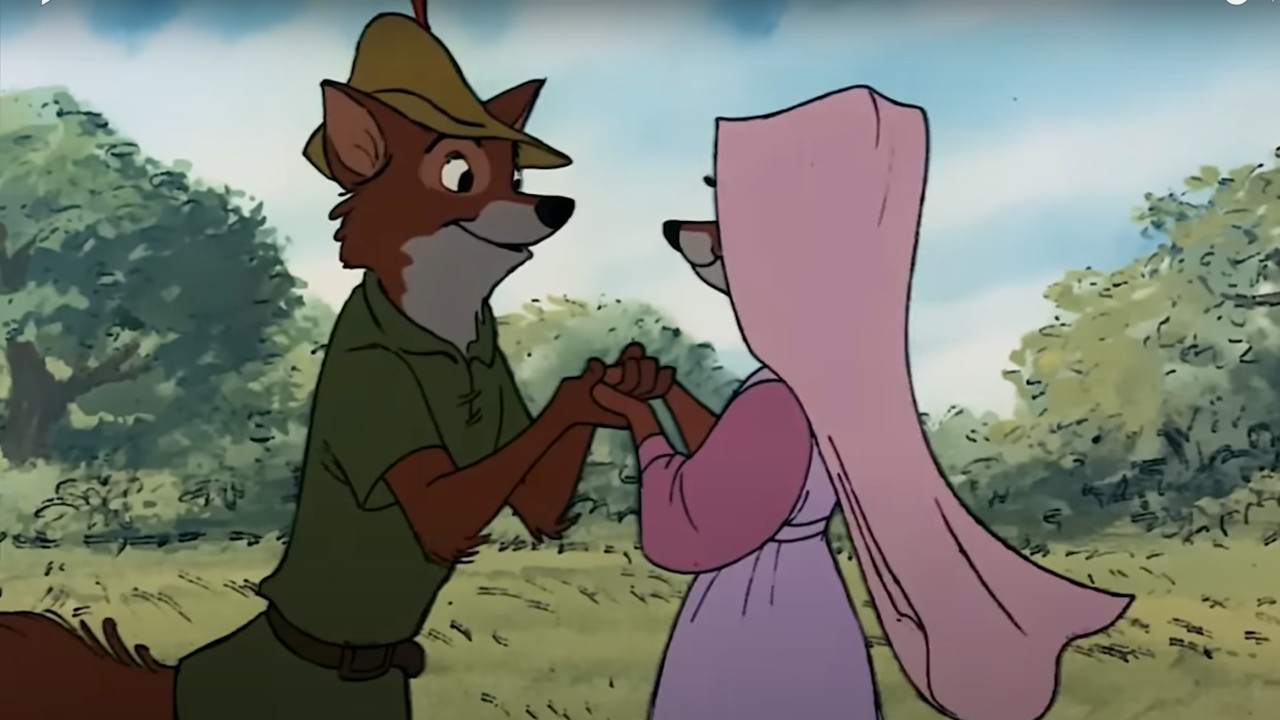 Robin Hood and Maid Marian, face to face, holding hands and talking to each other