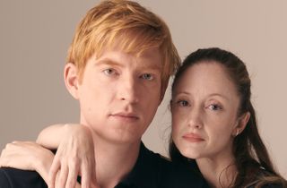 Domhnall Gleeson and Andrea Riseborough with their arms around each other in Alice & Jack 