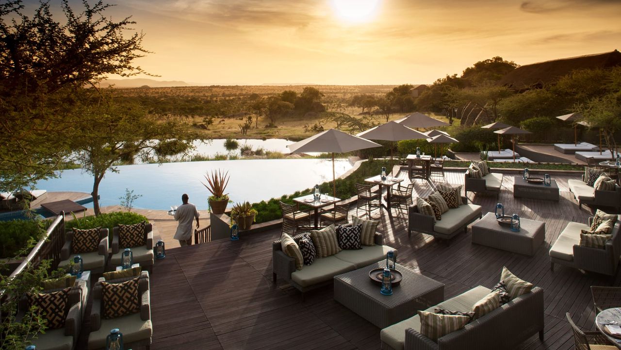 Image of pool decks with lots of different lounge areas that over look infinity pools and the Serengeti