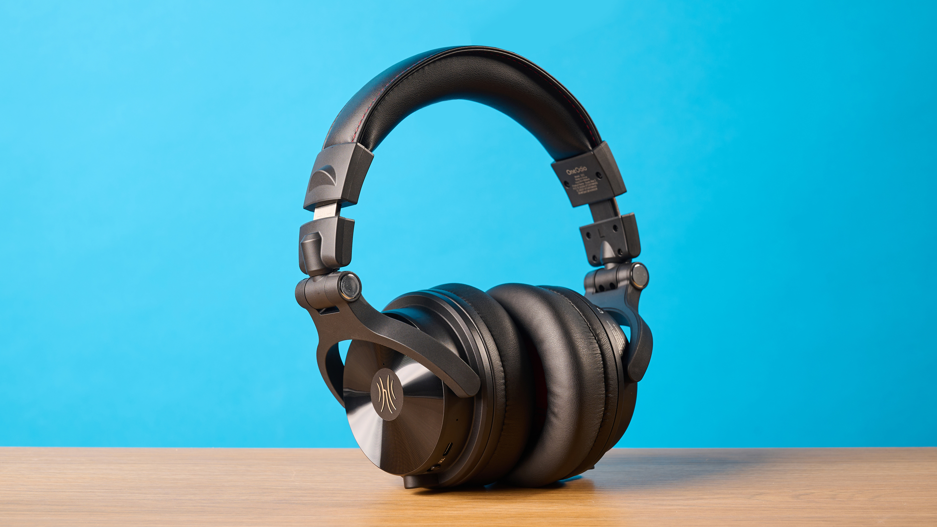 OneOdio Studio Max 2 in black photographed in front of a blue background