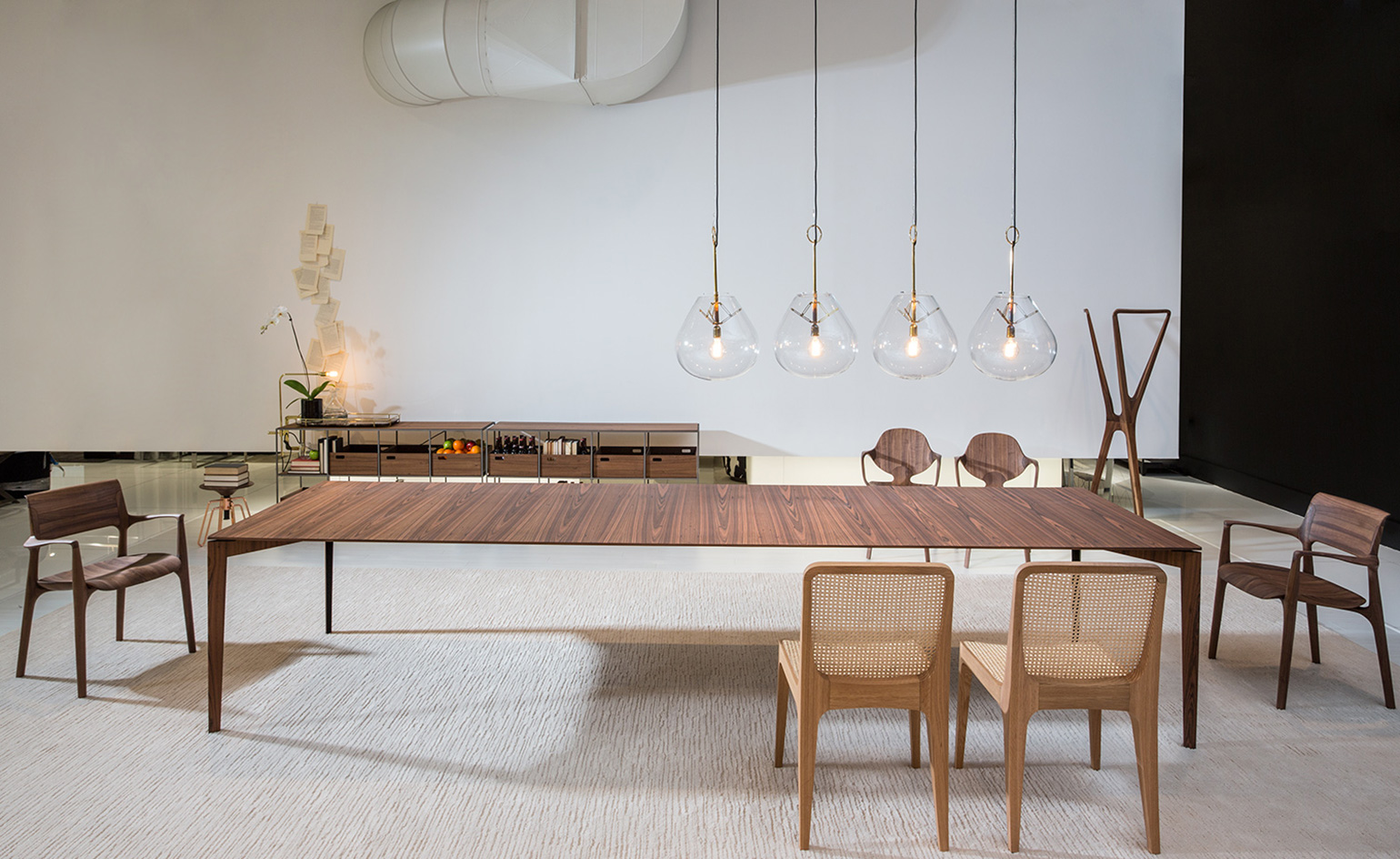 The collection includes stools of cork and marble, a number of tables and home accessories, like minimal gold and metallic light fixtures