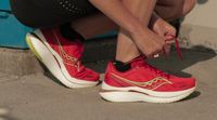 Runner tying laces on Saucony Endorphin Speed 3