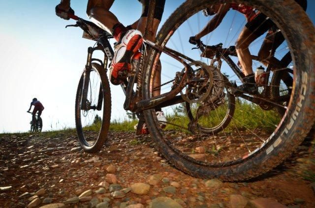 Racers fly over the terrain in Sabie