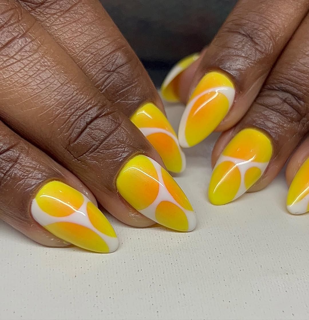 Yellow and orange aura ombr&amp;eacute; nails with white lines.