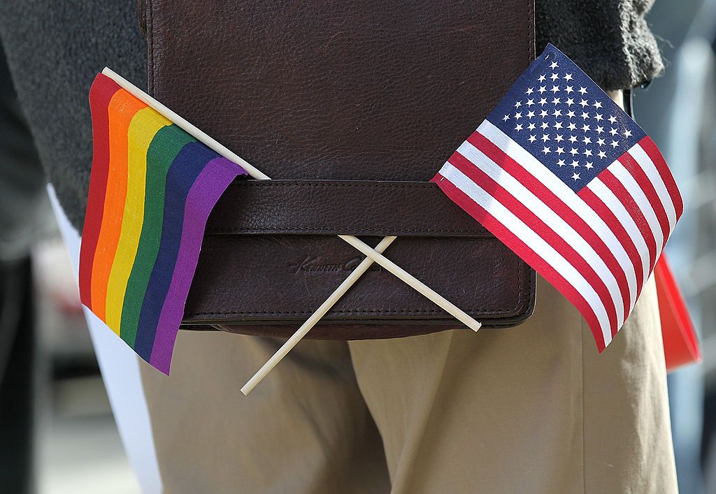 LGBT flag alongside a US flag