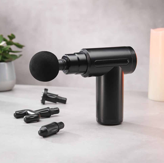 Image of mini massage gun with all the different parts