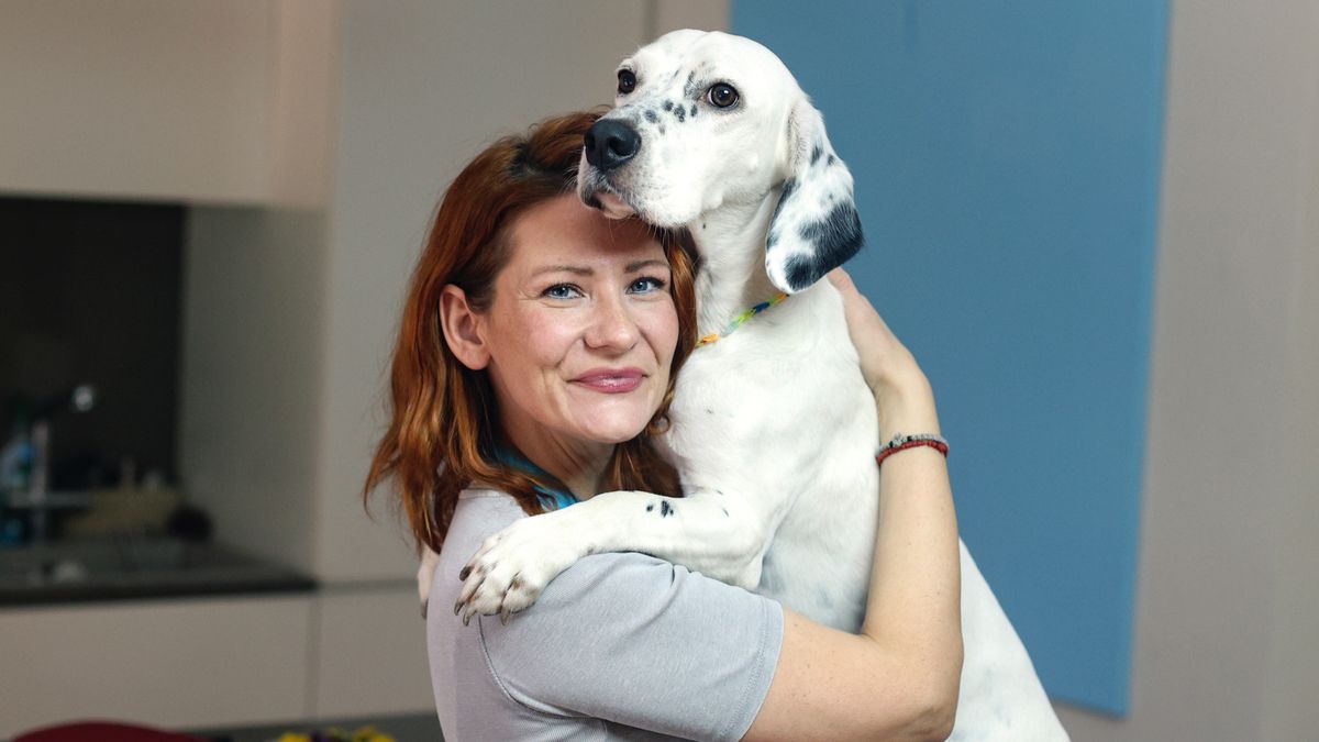 Woman hugging dog