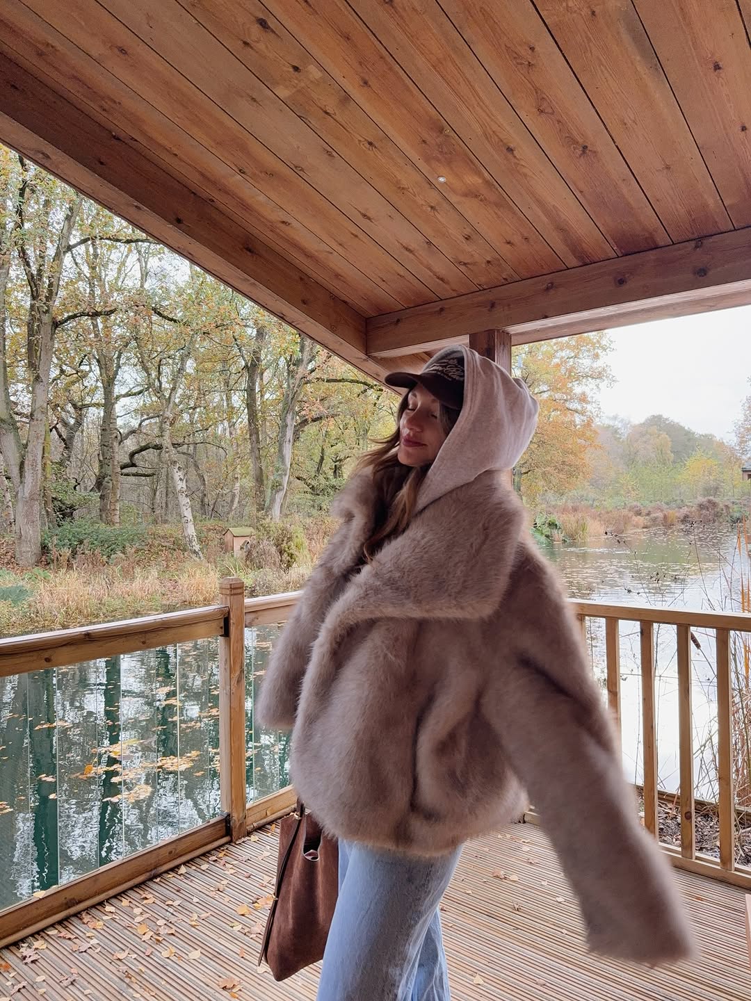 woman wearing winter denim outfit idea 2025