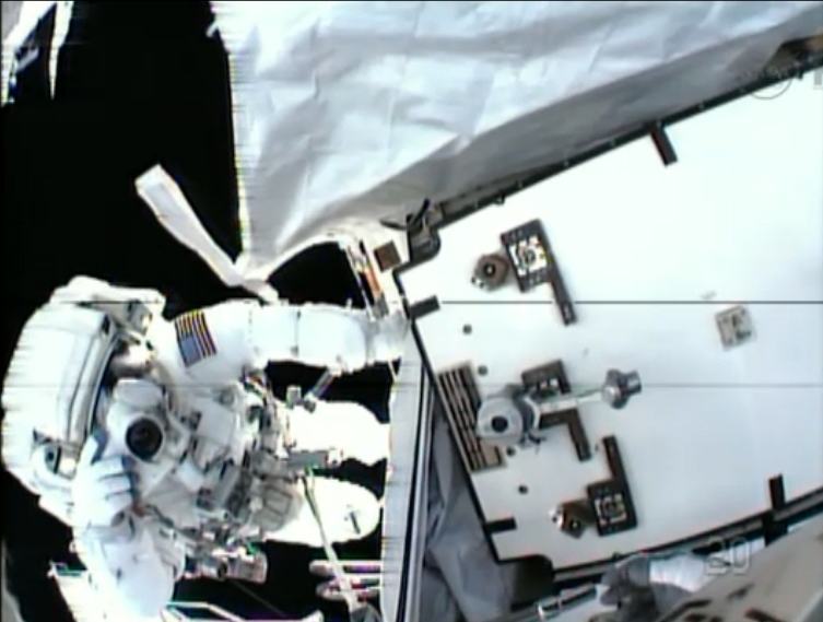 NASA astronaut Tom Marshburn snaps a photo of crewmate Chris Cassidy during a May 11, 2013 spacewalk in this view from Cassidy&#039;s helmet camera. 