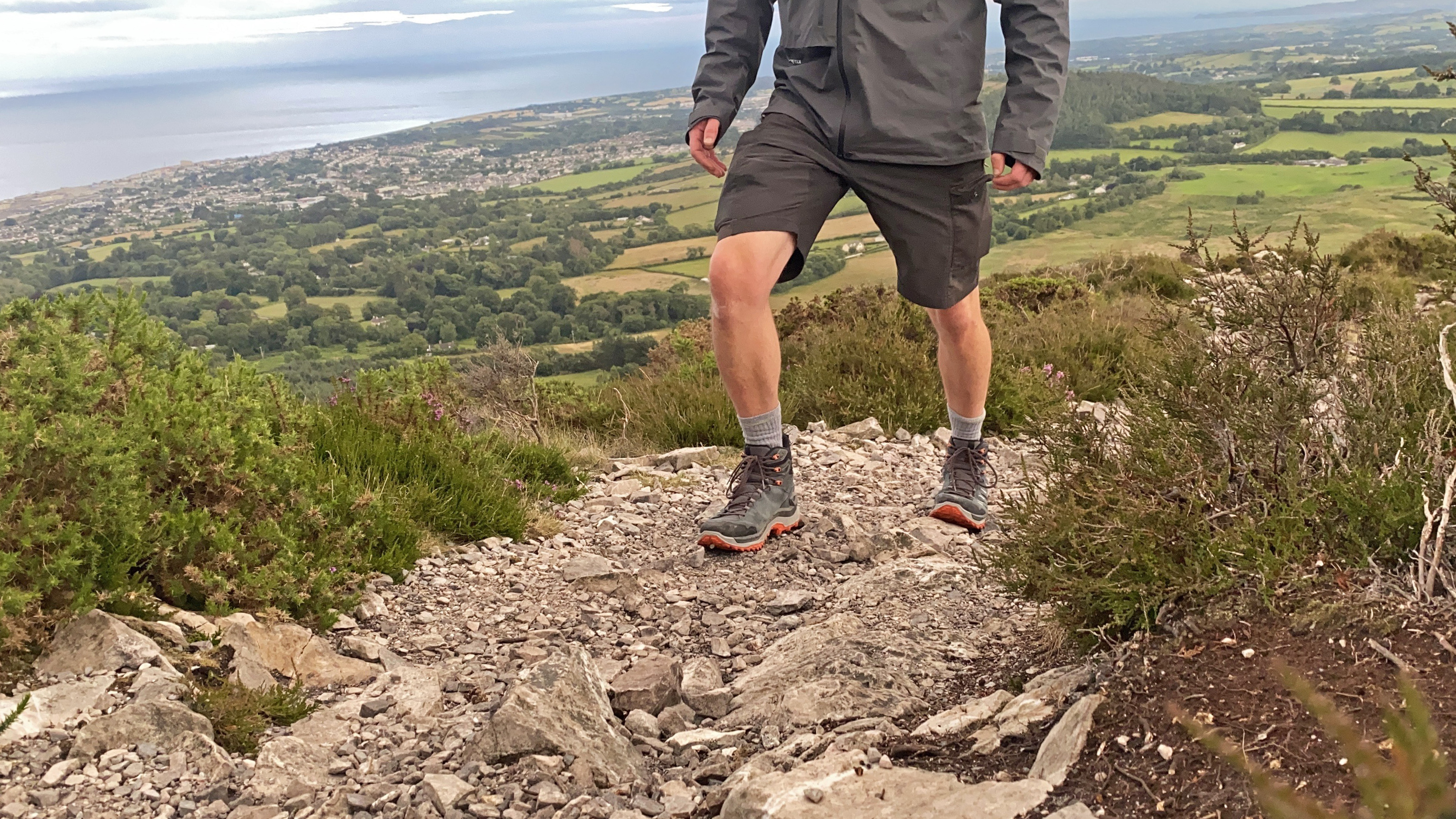 Hiker wearing the Innovo Mid GTX hiking boots on a trail