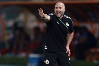 Algeria AFCON 2023 squad: Algeria's French coach Djamel Belmadi shouts instructions to his players from the touchline during the Africa Cup of Nations (CAN) 2024 group D football match between Algeria and Angola at Stade de la Paix in Bouake on January 15, 2024. (Photo by KENZO TRIBOUILLARD / AFP) (Photo by KENZO TRIBOUILLARD/AFP via Getty Images)