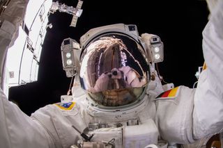 ESA astronaut Matthias Maurer points the camera toward himself and takes a "space selfie" during a spacewalk on March 23, 2022.