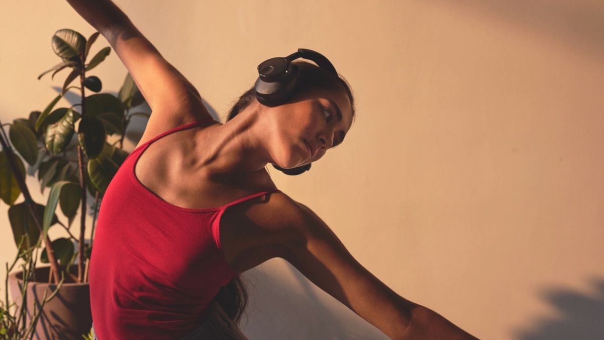 Cambridge Audio Melomania P100 worn by a female dance student, wearing a red top