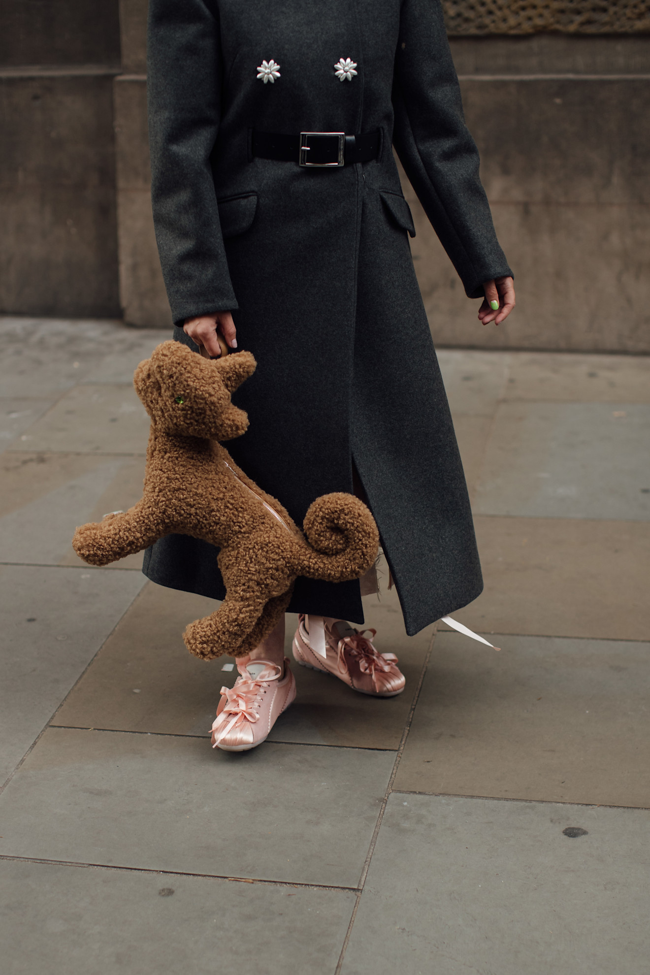 woman wearing pink satin sneakers