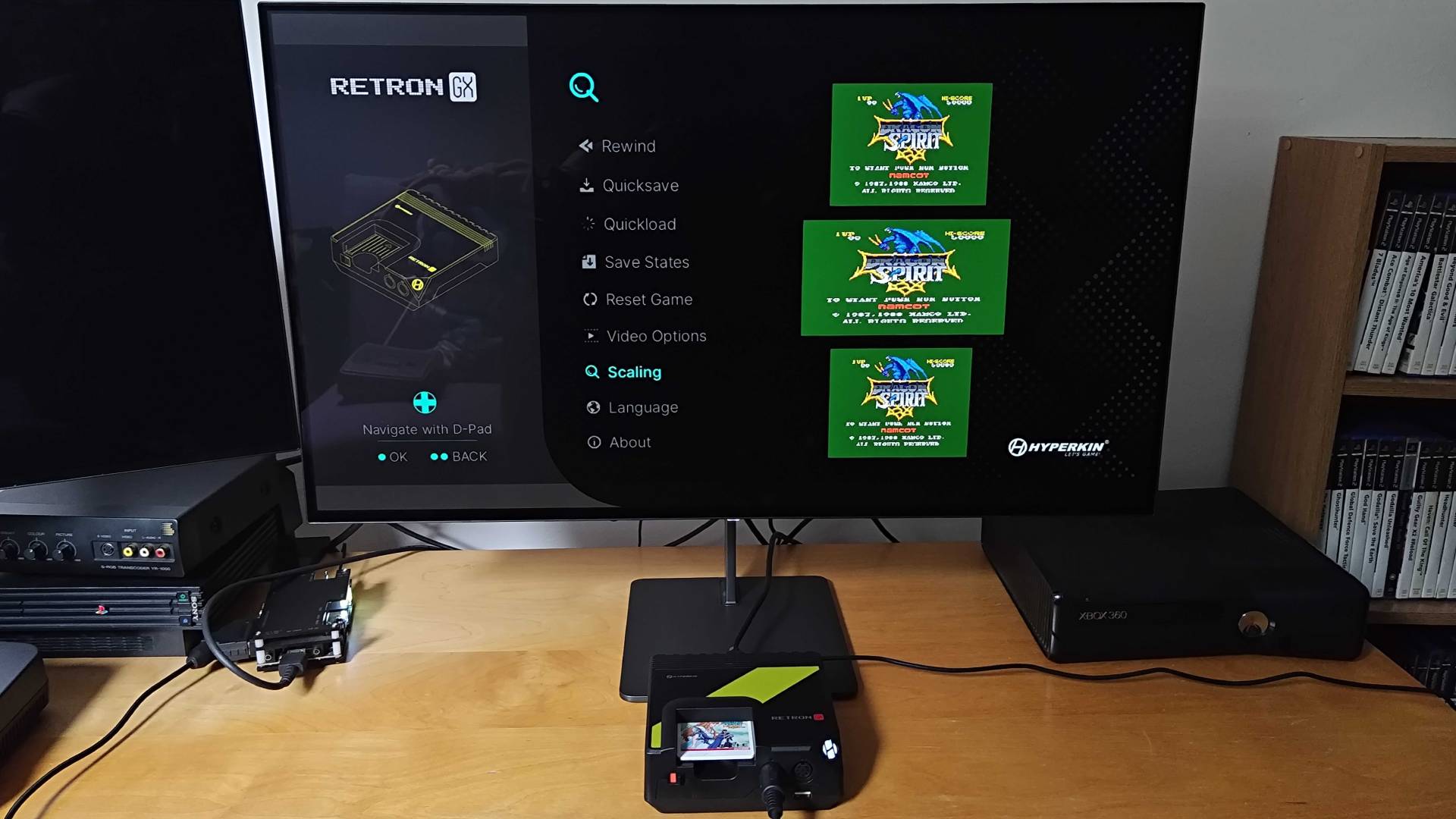 Hyperkin Retron GX plugged into monitor with scaling settings displayed.