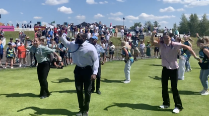 Dancers perform a flashmob on the first tee prior to LIV Golf's London event