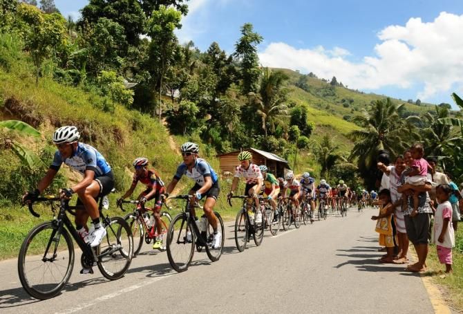 Riders in a long line up Ombilin, Batusangkar on Stage 2 at Tour de Singkarak