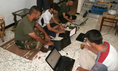 Members of the Free Syrian Army use laptops on Aug. 18: Today, they won't be able to connect to the internet.