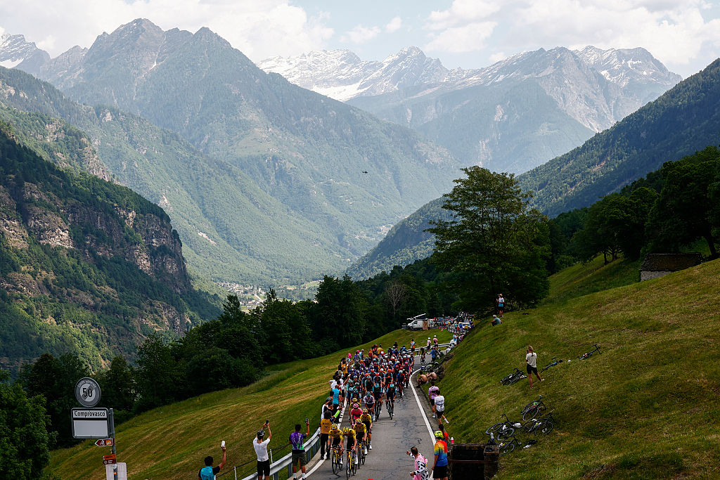 The pack rides during the 16th stage of the Giro d'Italia 2026 - Tour of Italy cycling race between Bellinzona and Cari, Switzerland, on May 26, 2026. (Photo by Luca Bettini / AFP)
