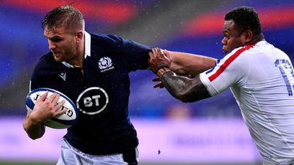 Chris Harris of Scotland is tackled by Virimi Vakatawa of France during the Guinness Six Nations Rugby Championship match between France and Scotland at Stade de France