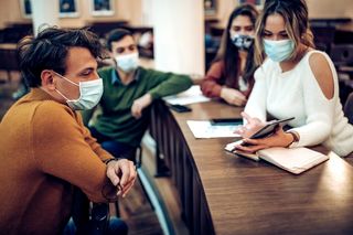 People wearing face masks indoors