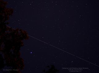 Skywatcher Stephen Mudge captured this photo of the Chinese Tiangong 1 and Shenzhou 9 spacecraft docked together over Brisbane, Australia June 20, 2012.