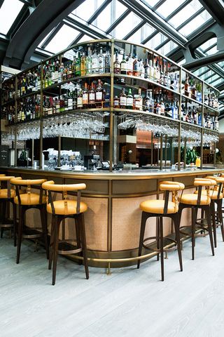 stools lined along the bar at Maison Bréguet, Paris