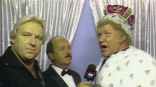 Harley Race getting interviewed in his cape and crown.