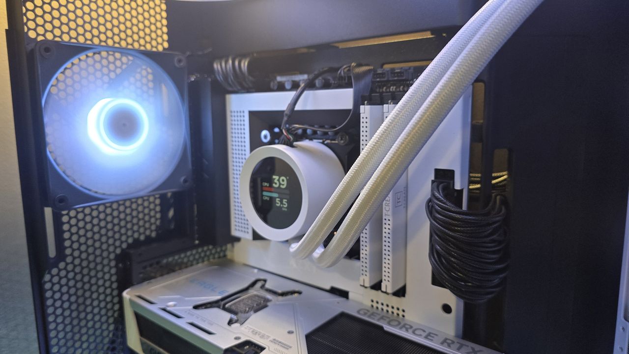 The NZXT Kraken Plus 360 RGB liquid cooler installed in a test bench.