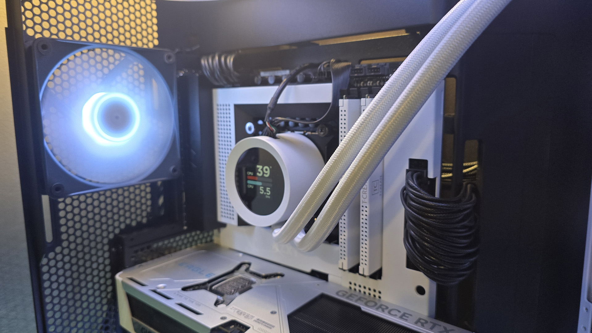 The NZXT Kraken Plus 360 RGB liquid cooler installed in a test bench.