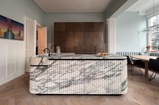 A kitchen with statement fluting on a marble island